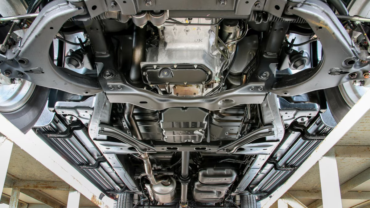 Technician welding truck frame components at Syracuse Frame Auto Repair